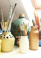 Vases filled with brushes and pencils
